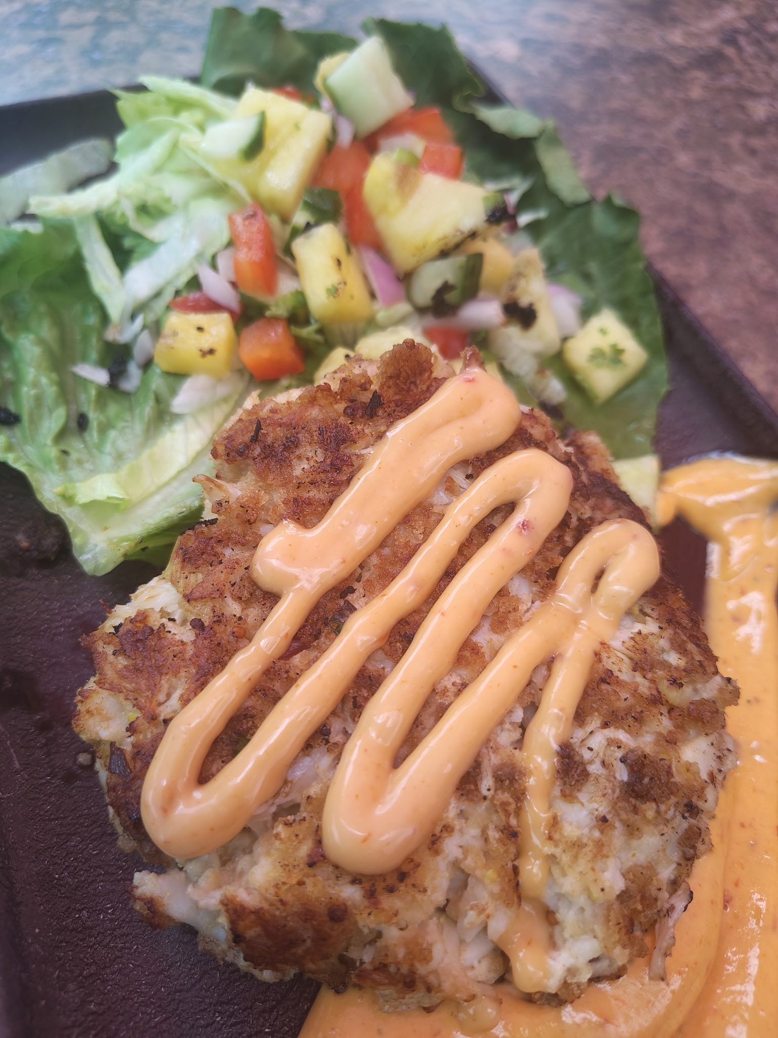 Firepit Salmon — fresh Gulf seafood dinner at The Courtyard Social, Holiday FL